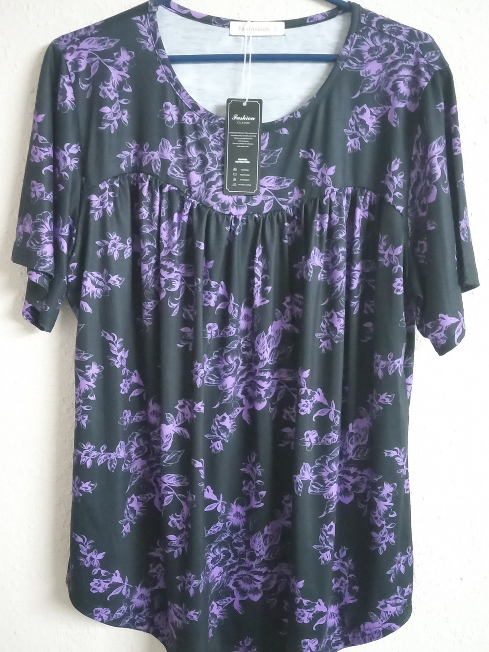 Fashion Collection Black Tunic Top with Purple Floral Print